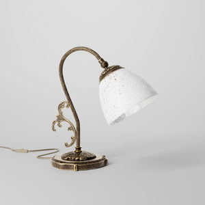 Art Nouveau brass table lamp with a spotted white glass shade and adjustable joint, ideal for elegant spaces by Ghidini 1849 - Finish: OAS Antique Brass