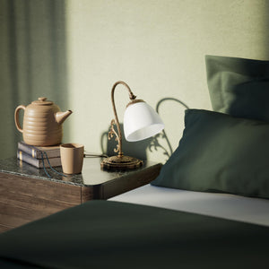 Art Nouveau brass table lamp with a spotted white glass shade and adjustable joint, ideal for elegant spaces by Ghidini 1849 - Finish: OAS Antique Brass