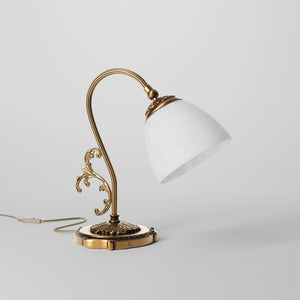 Art Nouveau brass table lamp with a spotted white glass shade and adjustable joint, ideal for elegant spaces by Ghidini 1849 - Finish: OBS Bronze Satin Brass