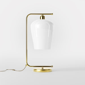 Table lamp with brass arm and white glass shade, elegant design for sophisticated interiors by Ghidini 1849 - Finish: OLV Polished Brass
