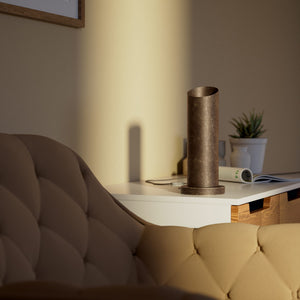 Brass table lamp with a sleek cylindrical shape and circular base, ideal for contemporary and elegant interiors by Ghidini 1849 - Finish: OAS Antique Brass