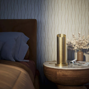 Brass table lamp with a sleek cylindrical shape and circular base, ideal for contemporary and elegant interiors by Ghidini 1849 - Finish: OBV Bronze Satin Light Brass
