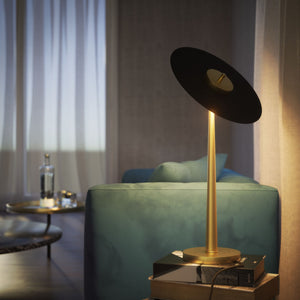 Table lamp with matte black vinyl-inspired shade, brass structure, and integrated LED. Elegant, adjustable, and unique design by Ghidini 1849 - Finish: OBV Bronze Satin Light Brass