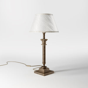 Classic brass table lamp with an ivory fabric shade, featuring an ornate column base, ideal for living rooms or office spaces by Ghidini 1849 - Finish: OAS Antique Brass