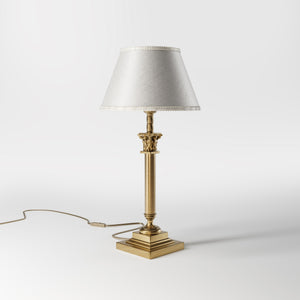 Classic brass table lamp with an ivory fabric shade, featuring an ornate column base, ideal for living rooms or office spaces by Ghidini 1849 - Finish: OBS Bronze Satin Brass