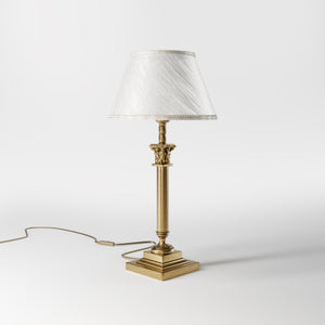 Classic brass table lamp with an ivory fabric shade, featuring an ornate column base, ideal for living rooms or office spaces by Ghidini 1849 - Finish: OBS Bronze Satin Brass