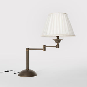 Table lamp with double adjustable arm, ivory pleated fabric shade and circular base - Finish: OBM Bronze Satin Matt Brass