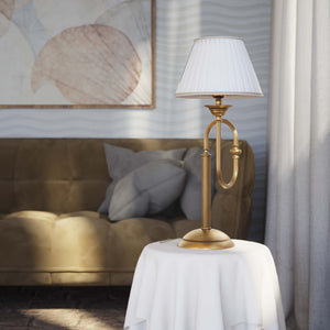 Brass table lamp with trombone-style design, ivory pleated shade, adjustable arm and decorated base, musical design Made in Italy by Ghidini 1849 - Finish: OBS Bronze Satin Brass