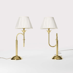 Brass table lamp with trombone-style design, ivory pleated shade, adjustable arm and decorated base, musical design Made in Italy by Ghidini 1849 - Finish: OLV Polished Brass