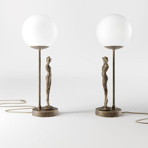 Brass table lamp with sculpted female figure and frosted glass globe, ideal for elegant interiors by Ghidini 1849 - Finish: OAS Antique Brass