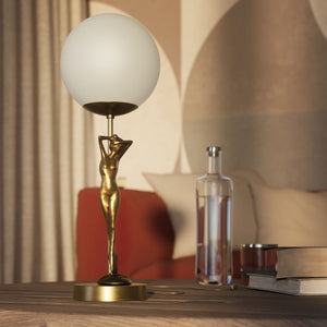 Brass table lamp with sculpted female figure and frosted glass globe, ideal for elegant interiors by Ghidini 1849 - Finish: OBS Bronze Satin Brass