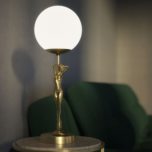 Brass table lamp with sculpted female figure and frosted glass globe, ideal for elegant interiors by Ghidini 1849 - Finish: OBV Bronze Satin Light Brass