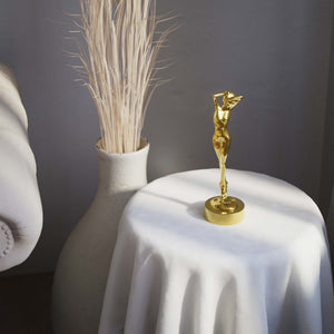 Art Deco decorative statue with dancing brass female figure, elegant pose and minimalist circular base by Ghidini 1849 - Finish: OLV Polished Brass