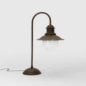 Brass table lamp with curved arm and glass diffuser, Italian design inspired by historic marine lanterns by Ghidini 1849 - Finish: OAS Antique Brass