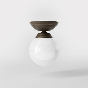 Classic ceiling light with glossy white glass globe and circular brass base elegant Italian design interior lighting by Ghidini 1849 - Finish: OBM Bronze Satin Matt Brass