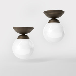 Classic ceiling light with glossy white glass globe and circular brass base elegant Italian design interior lighting by Ghidini 1849 - Finish: OBM Bronze Satin Matt Brass