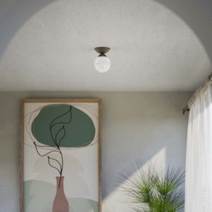 Classic ceiling light with glossy white glass globe and circular brass base elegant Italian design interior lighting by Ghidini 1849 - Finish: OBM Bronze Satin Matt Brass