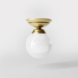 Classic ceiling light with glossy white glass globe and circular brass base elegant Italian design interior lighting by Ghidini 1849 - Finish: OBV Bronze Satin Light Brass
