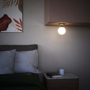 Classic ceiling light with glossy white glass globe and circular brass base elegant Italian design interior lighting by Ghidini 1849 - Finish: OBV Bronze Satin Light Brass