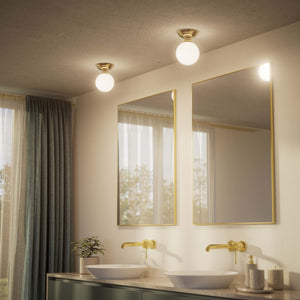 Classic ceiling light with glossy white glass globe and circular brass base elegant Italian design interior lighting by Ghidini 1849 - Finish: OLV Polished Brass