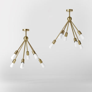 Modern brass chandelier with radial arms, elegant design, ideal for living rooms, lofts, and dining spaces by Ghidini 1849 - Finish: OBV Bronze Satin Light Brass