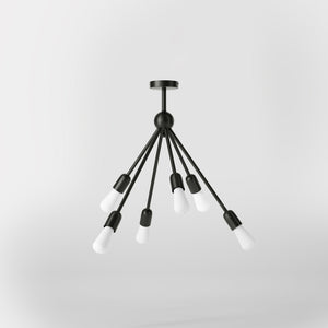 Modern brass chandelier with radial arms, elegant design, ideal for living rooms, lofts, and dining spaces by Ghidini 1849 - Finish: ONO Matt Black
