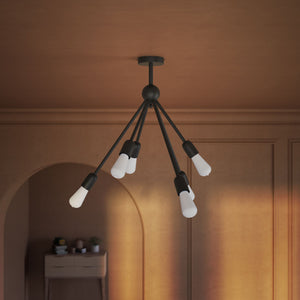 Modern brass chandelier with radial arms, elegant design, ideal for living rooms, lofts, and dining spaces by Ghidini 1849 - Finish: ONO Matt Black