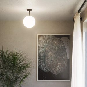 Brass ceiling light with opal glass globe, minimalist and elegant design for sophisticated interiors by Ghidini 1849 - Finish: ONO Matt Black