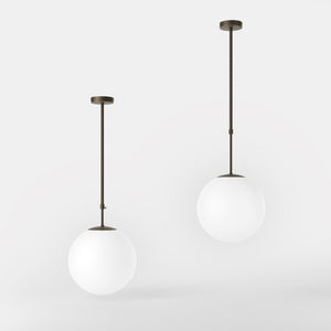 Art Deco globe pendant light with frosted glass sphere and adjustable brass structure Made in Italy design by Ghidini 1849 - Finish: OBM Bronze Satin Matt Brass