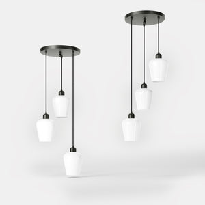 Pendant light with three white glass diffusers, brass details, and adjustable cables for elegant interiors by Ghidini 1849 - Finish: ONO Matt Black