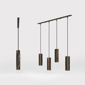 Modern pendant lamp with four brass cylinders and linear bar, height-adjustable pendants with fabric cables, minimalist Venere design by Ghidini 1849 - Finish: OBM Bronze Satin Matt Brass