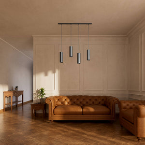 Modern pendant lamp with four brass cylinders and linear bar, height-adjustable pendants with fabric cables, minimalist Venere design by Ghidini 1849 - Finish: ONO Matt Black