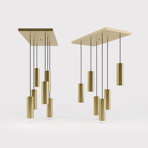 Modern pendant lamp with six brass cylinders arranged in cascade pattern, rectangular base, adjustable fabric cables, Venere design by Ghidini 1849 - Finish: OBV Bronze Satin Light Brass