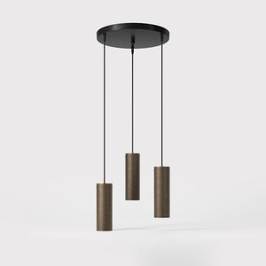 Modern pendant lamp with three brass cylinders and round matte black iron base, height-adjustable pendants, Venere design collection by Ghidini 1849 - Finish: OBM Bronze Satin Matt Brass