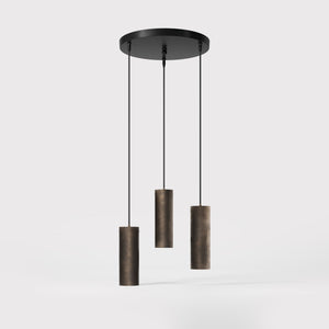 Modern pendant lamp with three brass cylinders and round matte black iron base, height-adjustable pendants, Venere design collection by Ghidini 1849 - Finish: OBM Bronze Satin Matt Brass