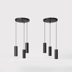 Modern pendant lamp with three brass cylinders and round matte black iron base, height-adjustable pendants, Venere design collection by Ghidini 1849 - Finish: ONO Matt Black