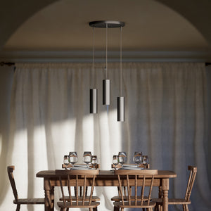 Modern pendant lamp with three brass cylinders and round matte black iron base, height-adjustable pendants, Venere design collection by Ghidini 1849 - Finish: ONO Matt Black