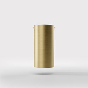 Cylinder ceiling lamp in brass with compact body installed on the ceiling of an elegant corridor by Ghidini 1849 - Finish: OBV Bronze Satin Light Brass
