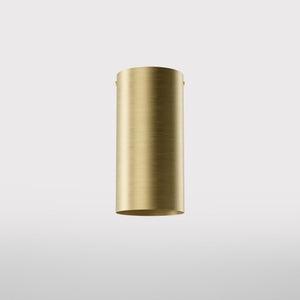 Cylinder ceiling lamp in brass with compact body installed on the ceiling of an elegant corridor by Ghidini 1849 - Finish: OBV Bronze Satin Light Brass