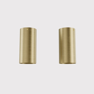 Cylinder ceiling lamp in brass with compact body installed on the ceiling of an elegant corridor by Ghidini 1849 - Finish: OBV Bronze Satin Light Brass