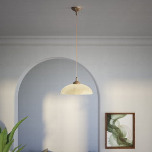 Art Nouveau brass pendant light with floral decorated canopy and large dome-shaped frosted glass diffuser with geometric pattern by Ghidini 1849 - Finish: OAS Antique Brass