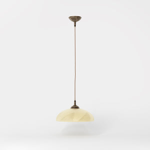 Art Nouveau brass pendant light with floral decorated canopy and large dome-shaped frosted glass diffuser with geometric pattern by Ghidini 1849 - Finish: OAS Antique Brass