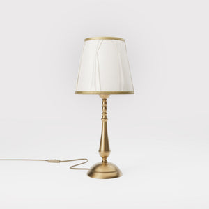 Classic brass table lamp with ivory fabric shade and decorative trims, round base and turned stem by Ghidini 1849 - Dimension/Finish: Medium / OBS Bronze Satin Brass