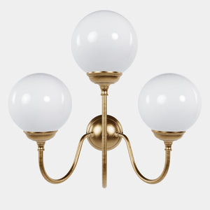 Brass wall lamp with three glossy white glass globes, elegant design, interior lighting by Ghidini 1849 - Finish: OBS Bronze Satin Brass