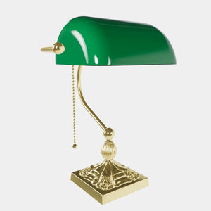 Banker’s lamp in brass with green glass shade, decorative base, and pull-chain switch. Elegant desk or decorative lighting by Ghidini 1849 - Finish: OLV Polished Brass