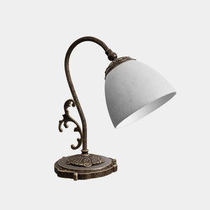 Art Nouveau brass table lamp with a spotted white glass shade and adjustable joint, ideal for elegant spaces by Ghidini 1849 - Finish: OAS Antique Brass