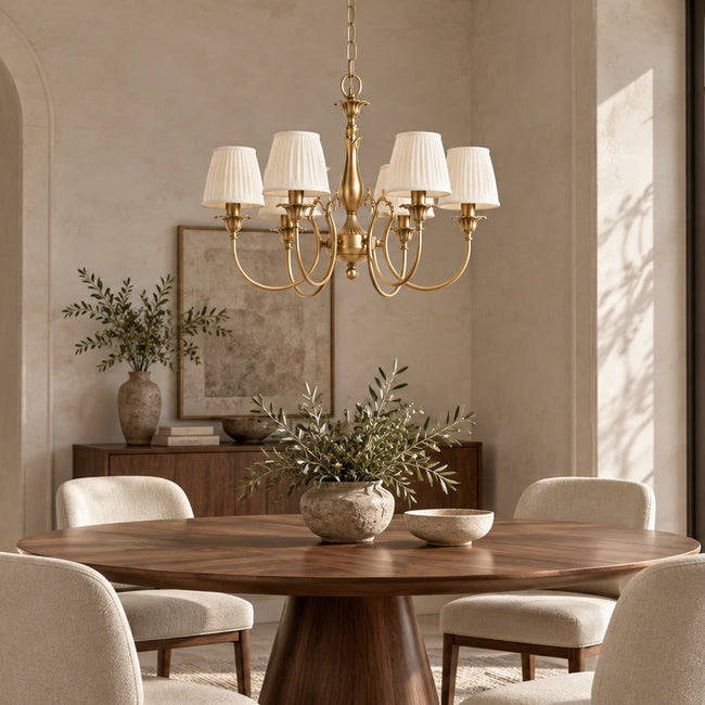 Ginevra brass chandelier above a walnut dining table