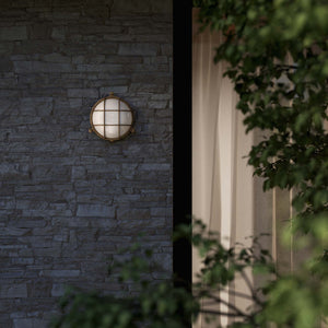 Round outdoor wall lamp in brass with protective grid and glass, marine style for outdoor lighting by Ghidini 1849 - Finish: OAS Antique Brass