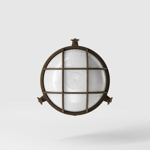 Round outdoor wall lamp in brass with protective grid and glass, marine style for outdoor lighting by Ghidini 1849 - Finish: OBM Bronze Satin Matt Brass