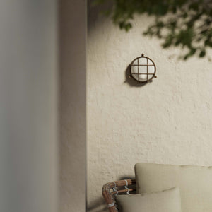 Round outdoor wall lamp in brass with protective grid and glass, marine style for outdoor lighting by Ghidini 1849 - Finish: OBM Bronze Satin Matt Brass